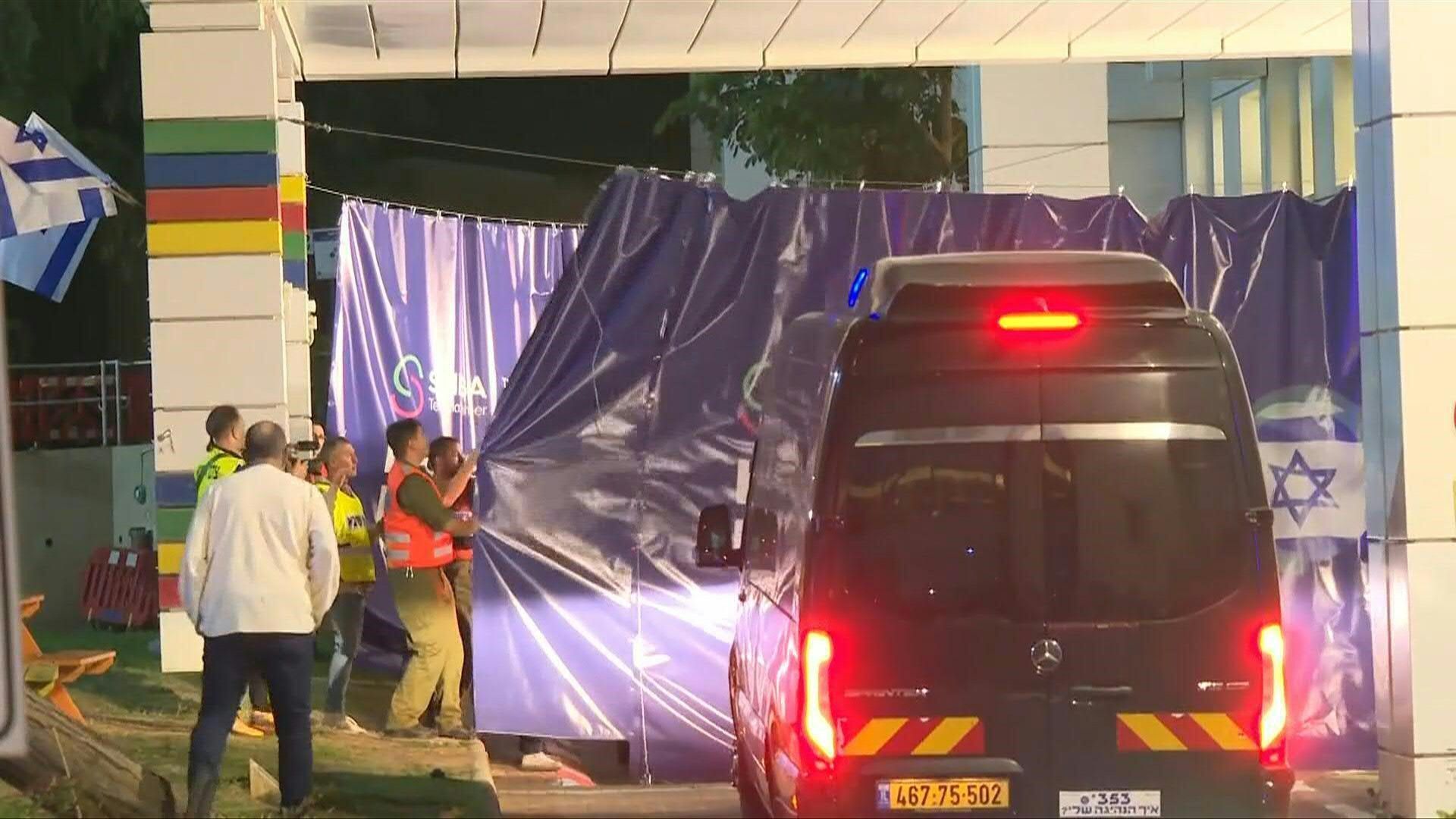 Vehicles with Israeli hostages released by Hamas arrive at Sheba Medical Center