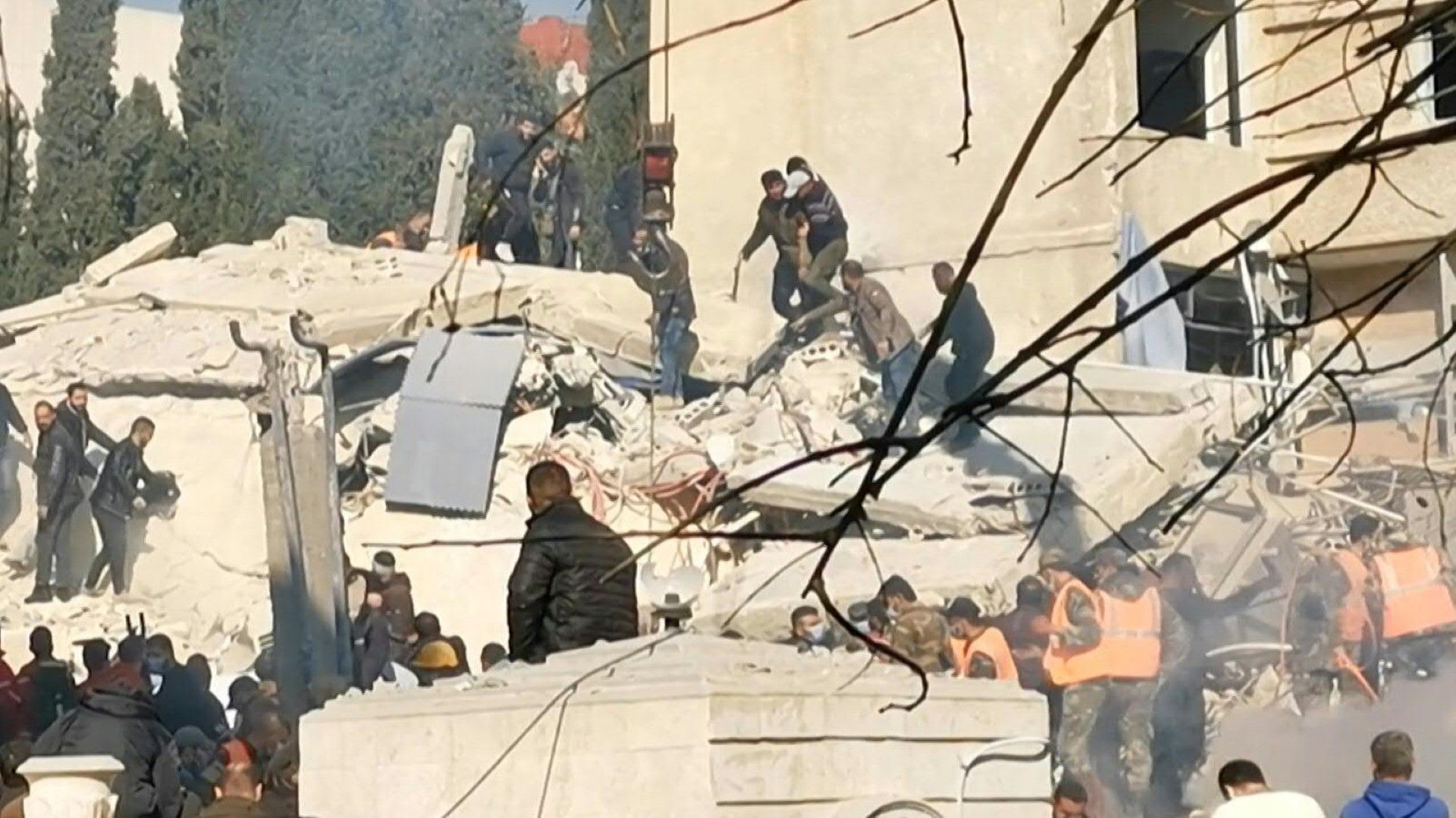 Emergency services at the site of deadly Israeli strike on Damascus