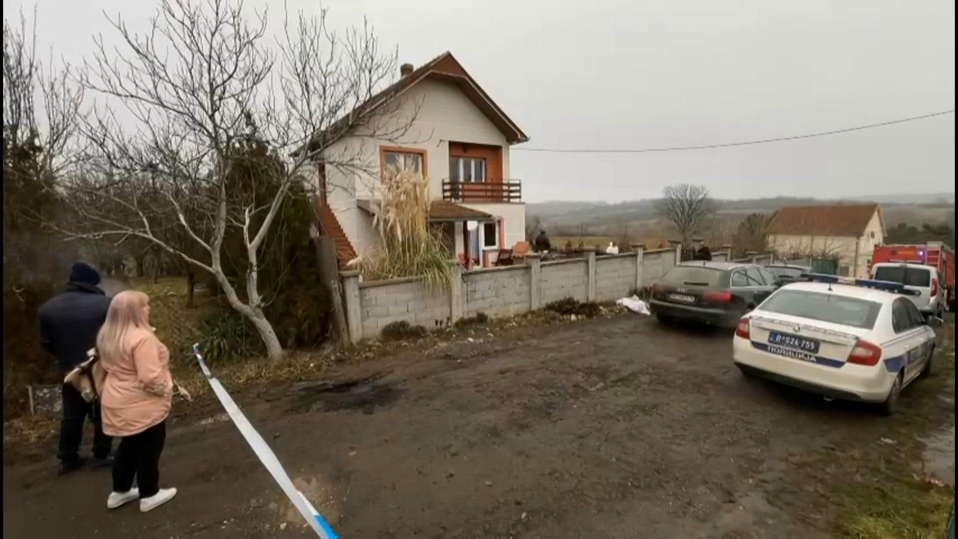 Police outside retirement home in Serbia where eight killed in fire