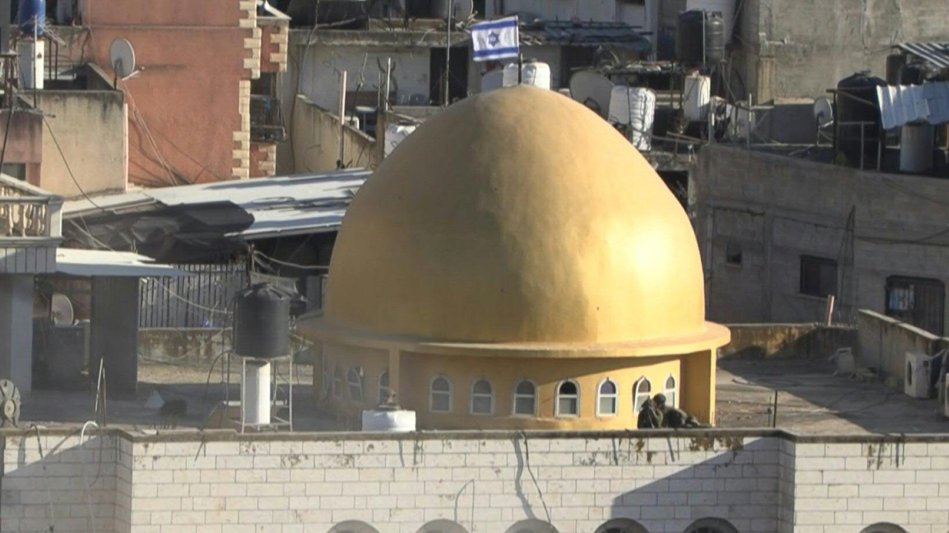 Israeli flag atop mosque's dome in West Bank's Nur Shams camp