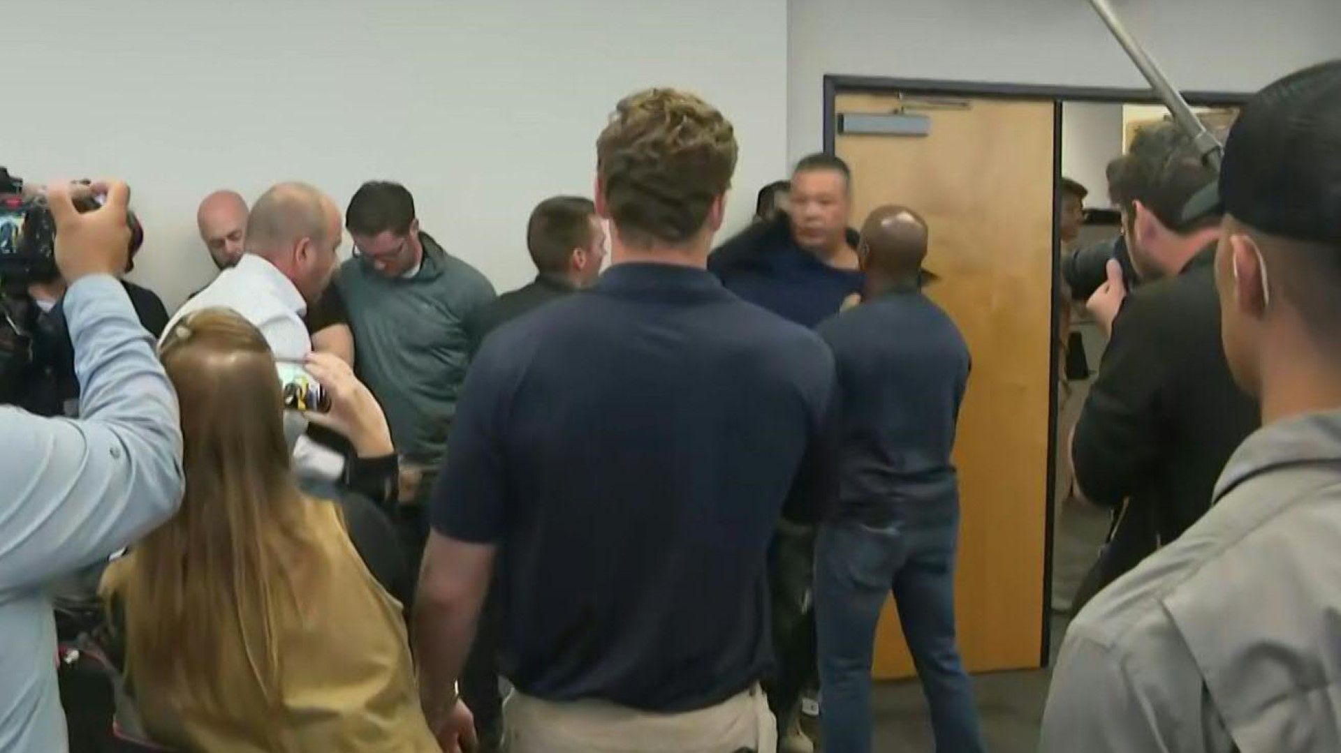 US senator forcibly removed from Trump official's press conference