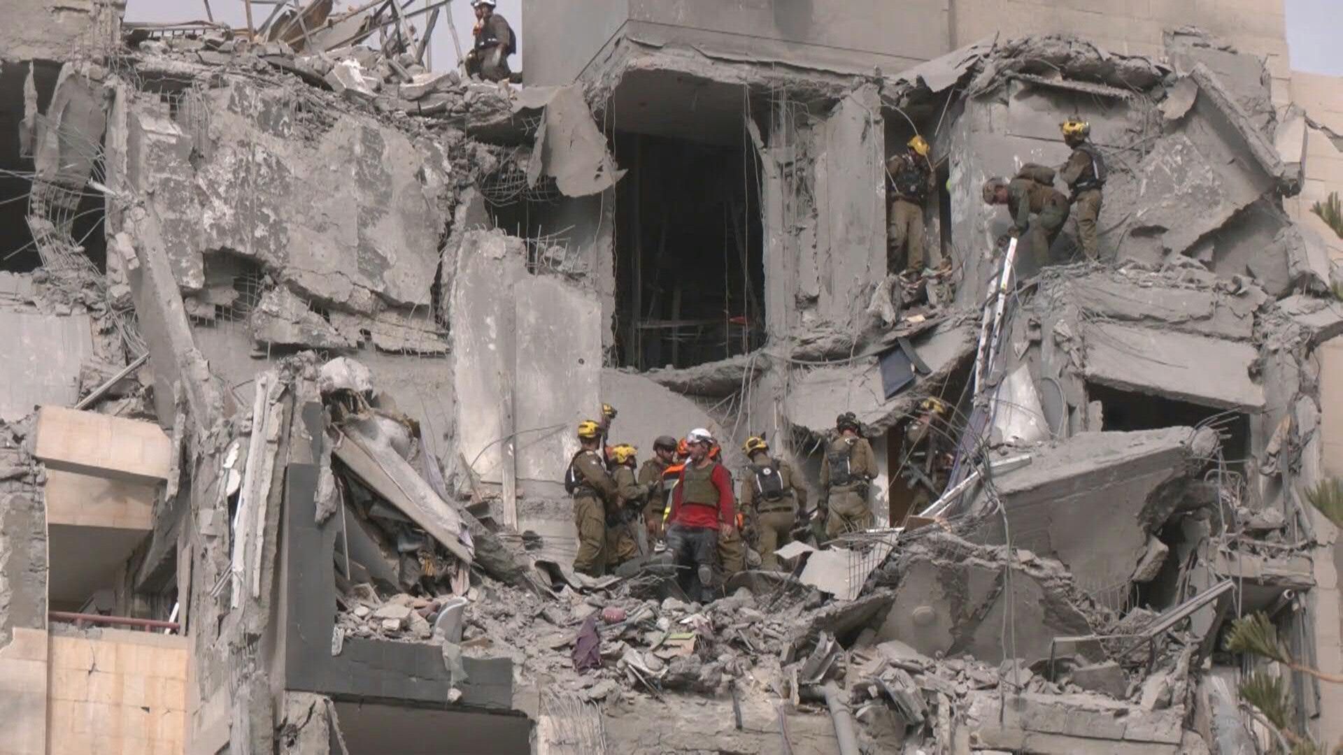 Video: Israel rescuers search rubble of building hit by deadly Iranian strike