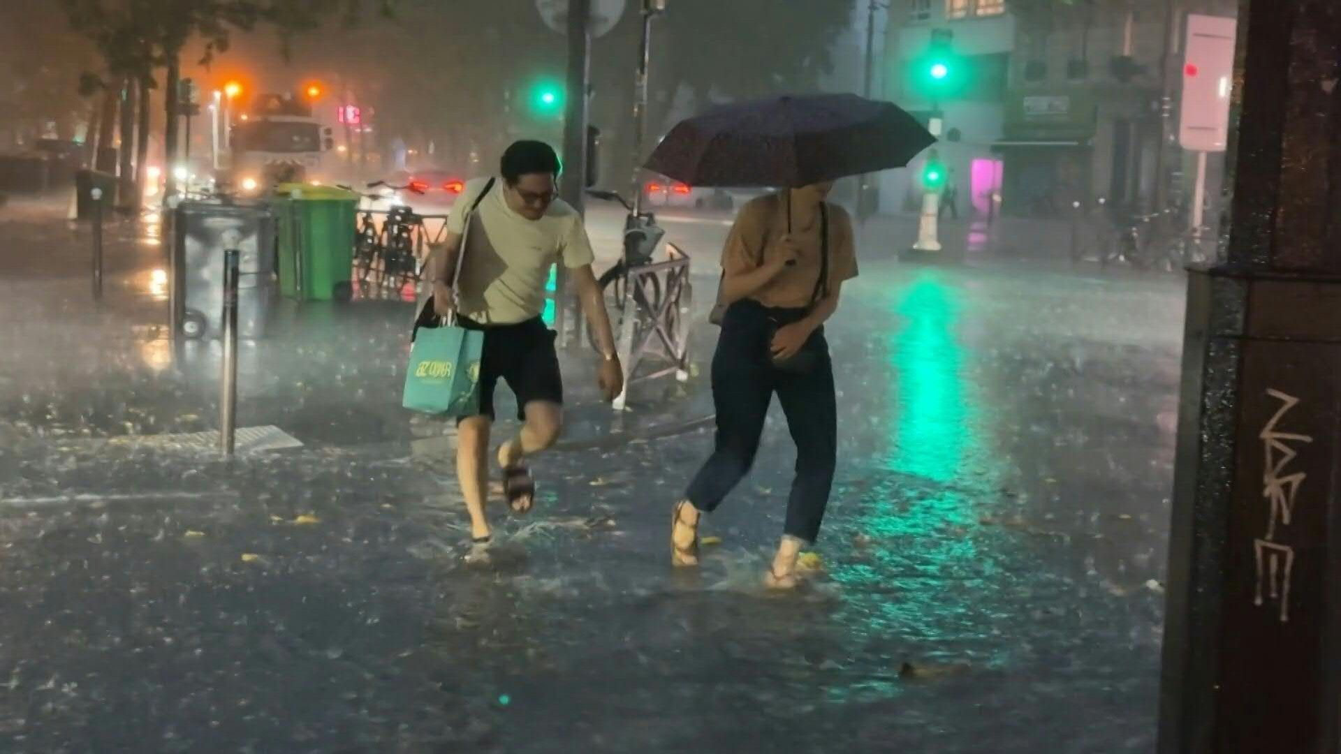 Video: Paris streets flood as storm hits amid heatwave
