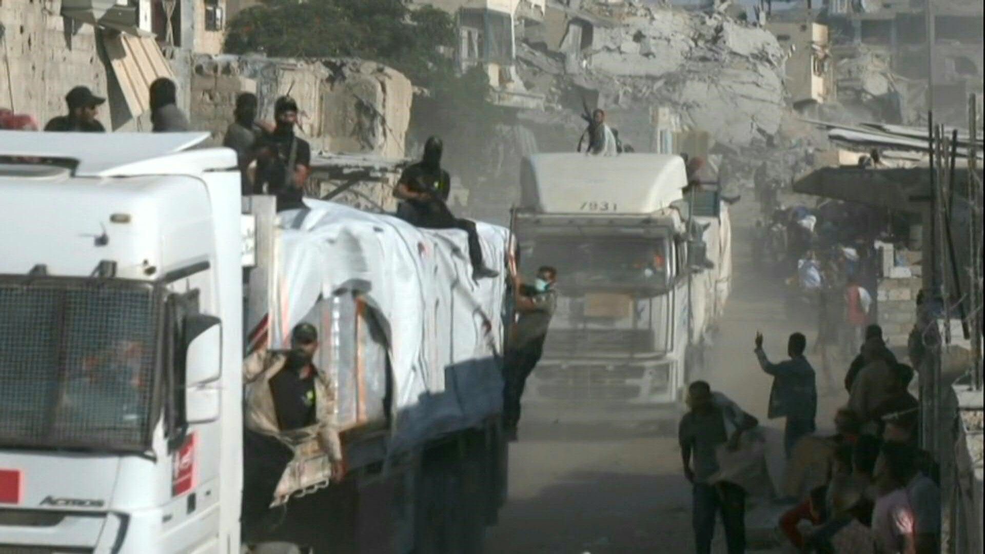 Video: Gunshots as vehicles carrying aid drive through Gaza's Khan Yunis