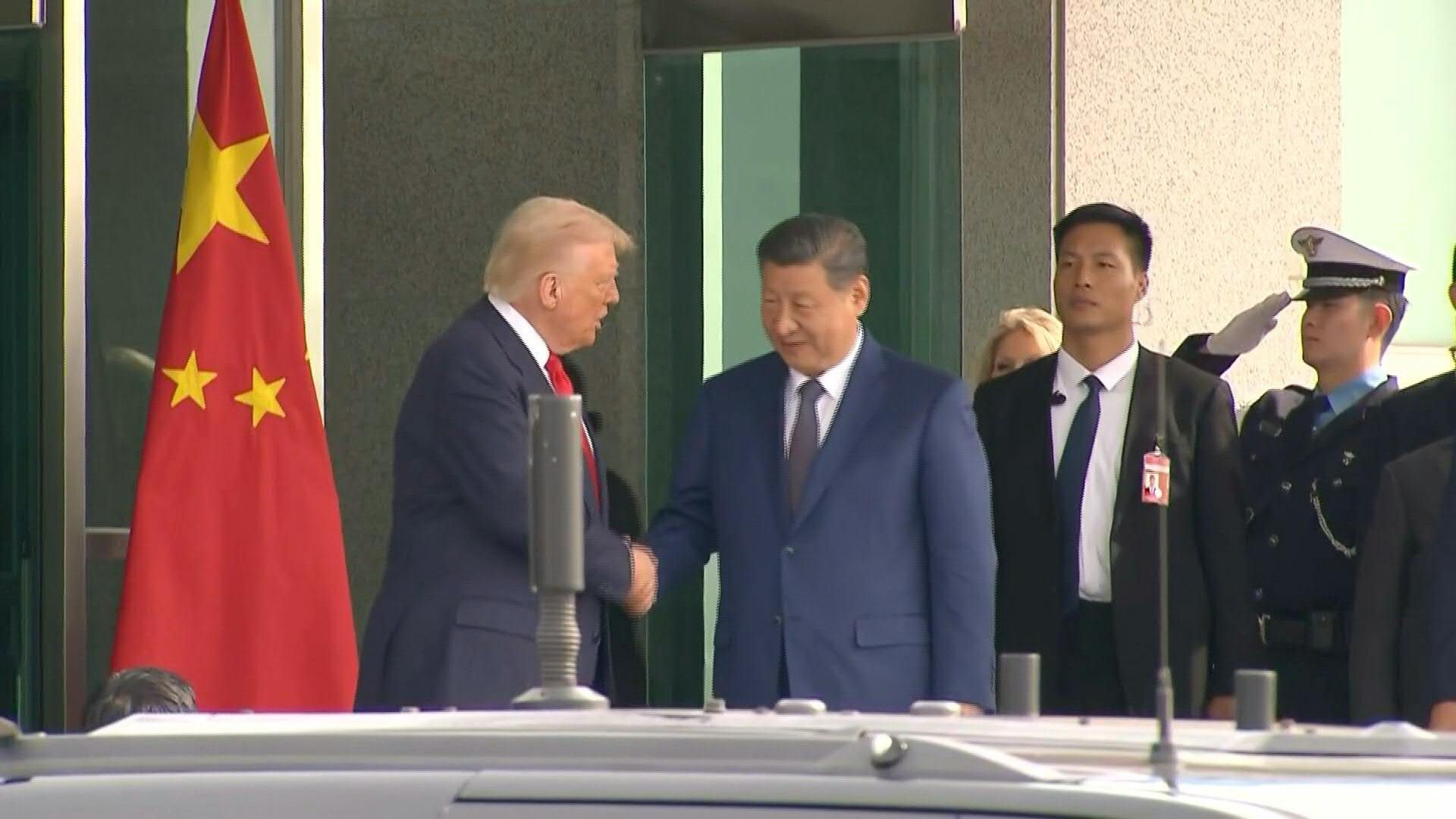 Trump and Xi shake hands after talks