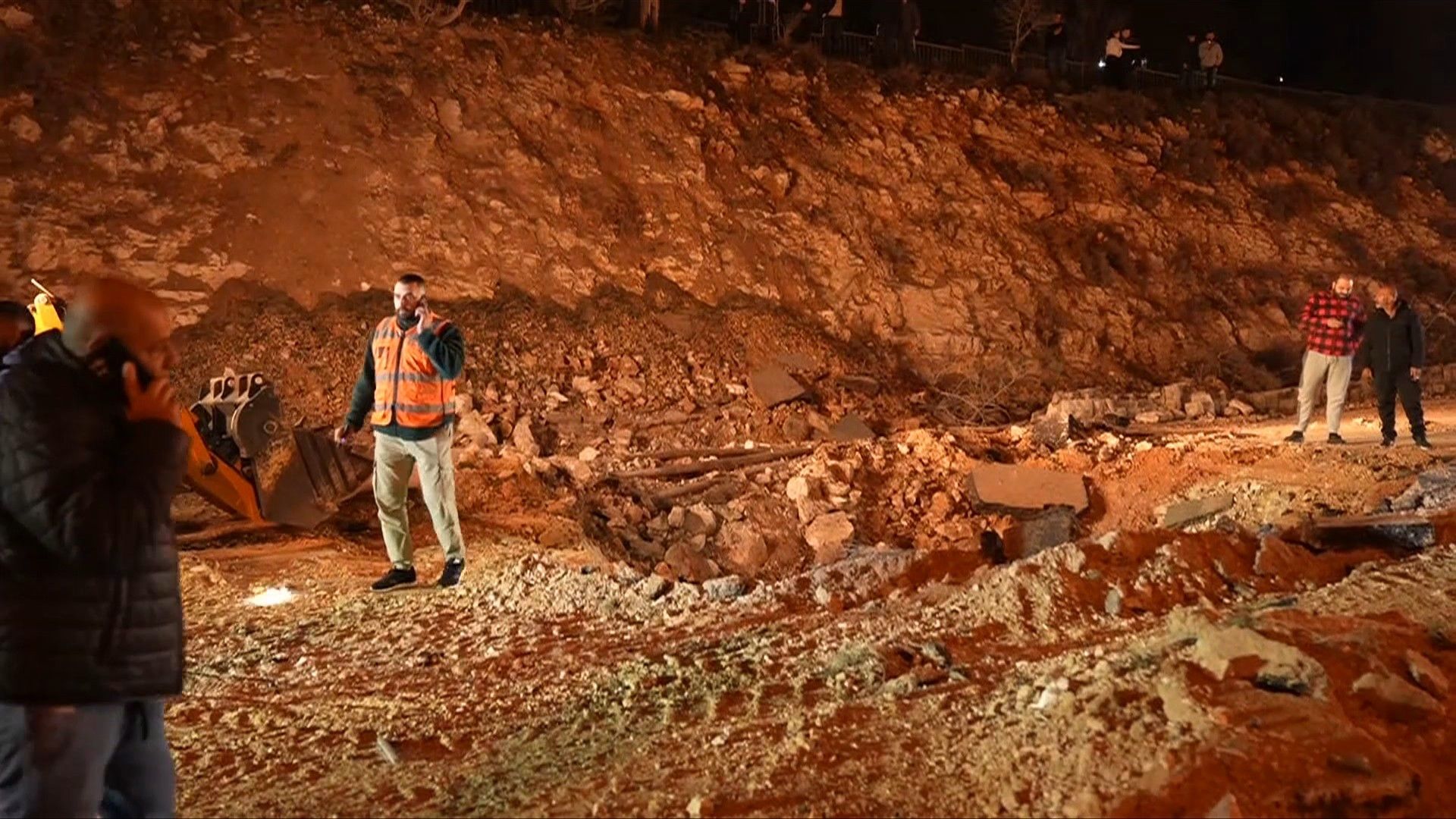 Video: After Iran missile barrage injures seven, workers fill crater on Jerusalem road