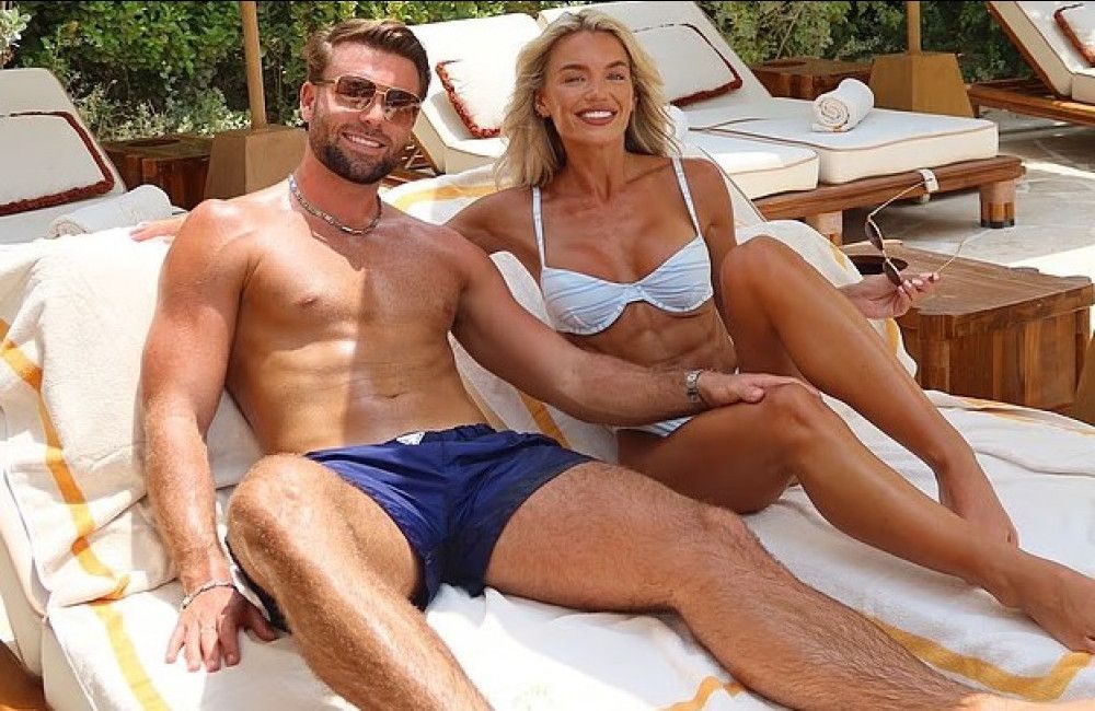 Molly Smith poses in seductive white bikini as she shows off her engagement ring