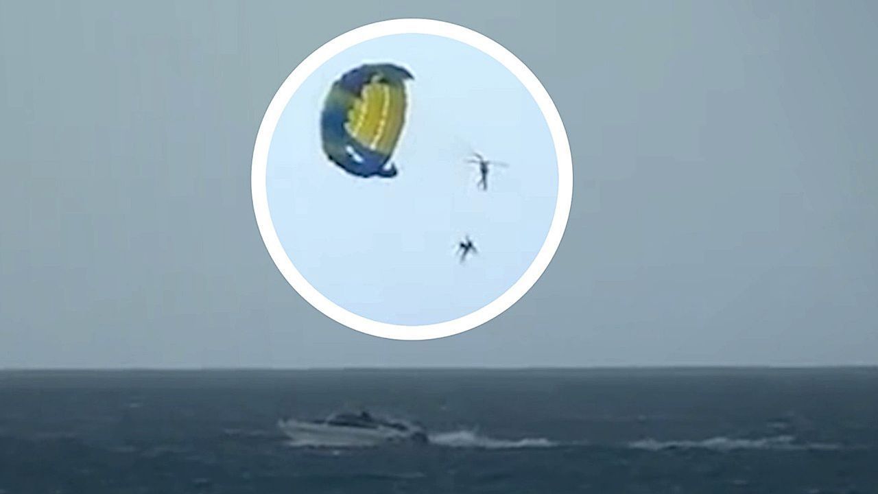 Tourist spins out of control after paragliding instructor plunges out of sky