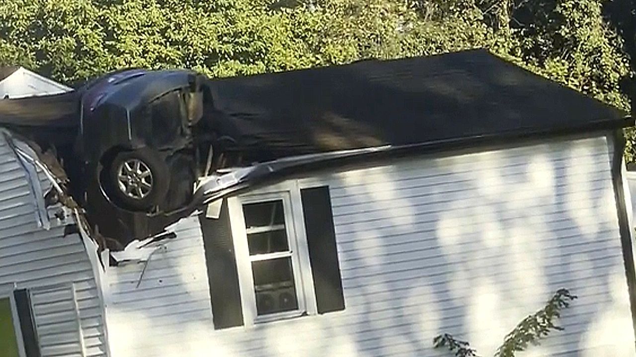 Car somehow crashed vertically through Tennessee home's roof