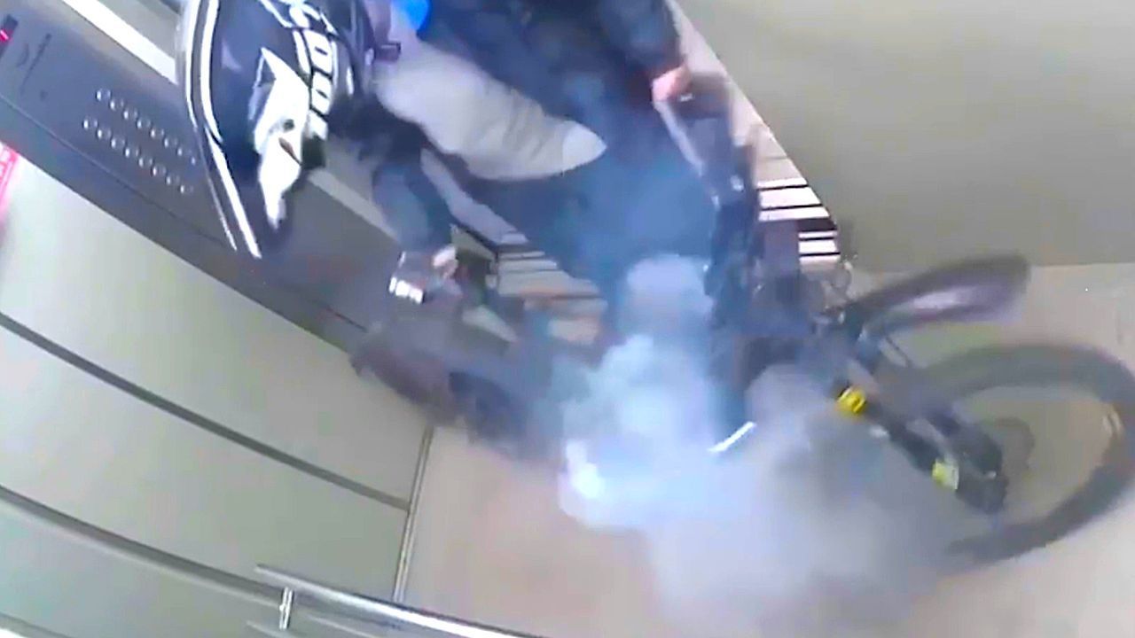 Quick-thinking rider drags flaming e-bike from elevator in Russia