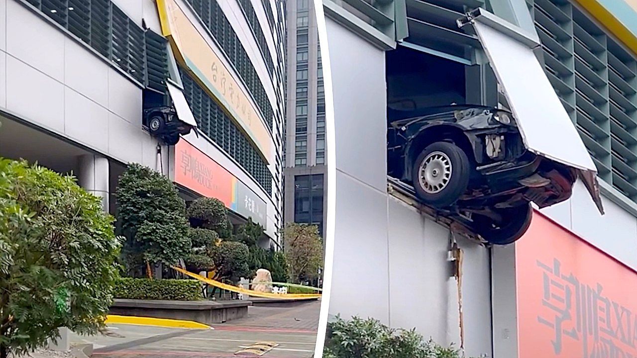 Video: Car left dangling after driver crashes through second-floor barrier