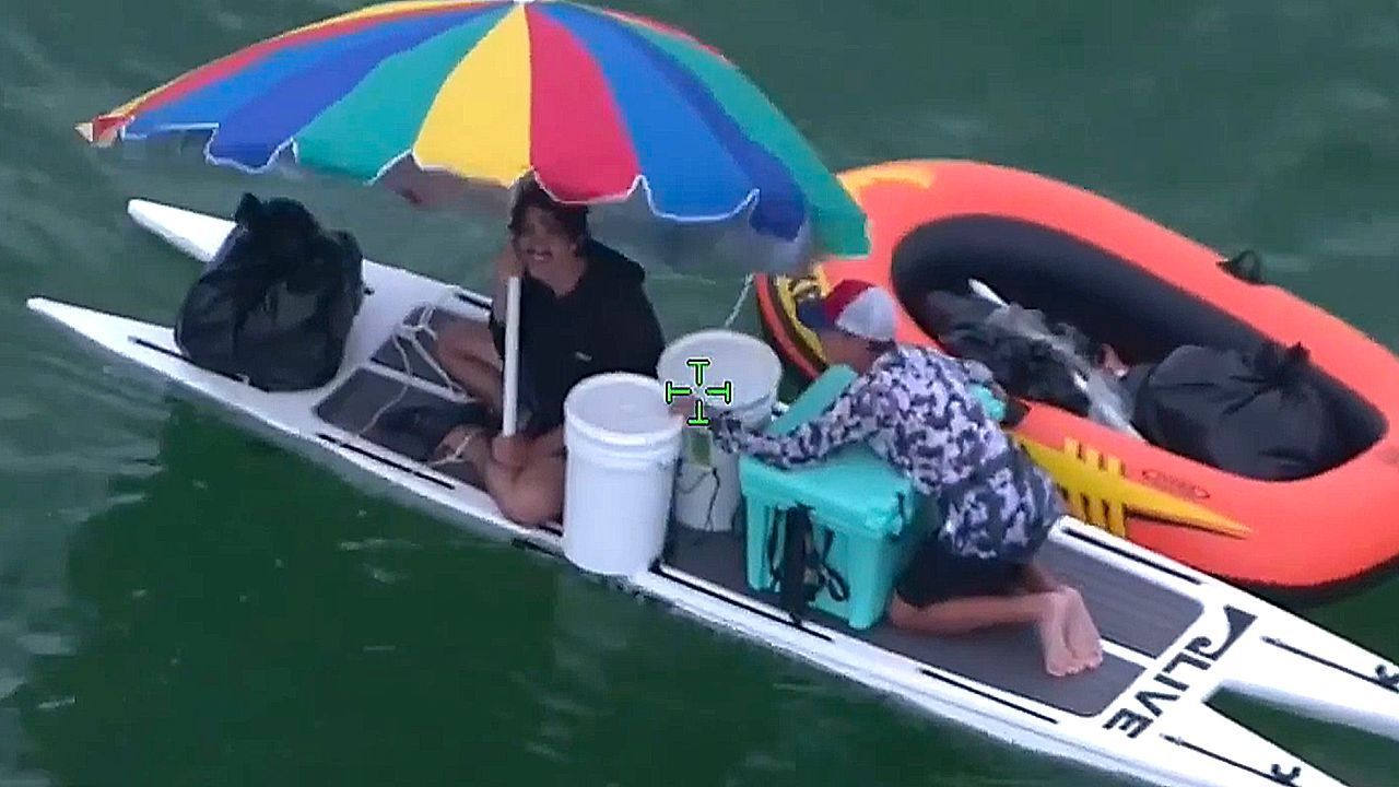 Video: Florida paddleboarders swept out to sea rescued after trying to use umbrella as makeshift sail