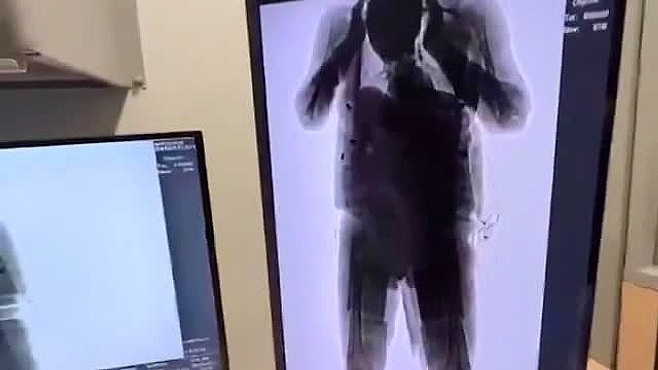 Video: Smuggler disguised as pilot caught with 22lb of drugs strapped to his torso at Colombian airport