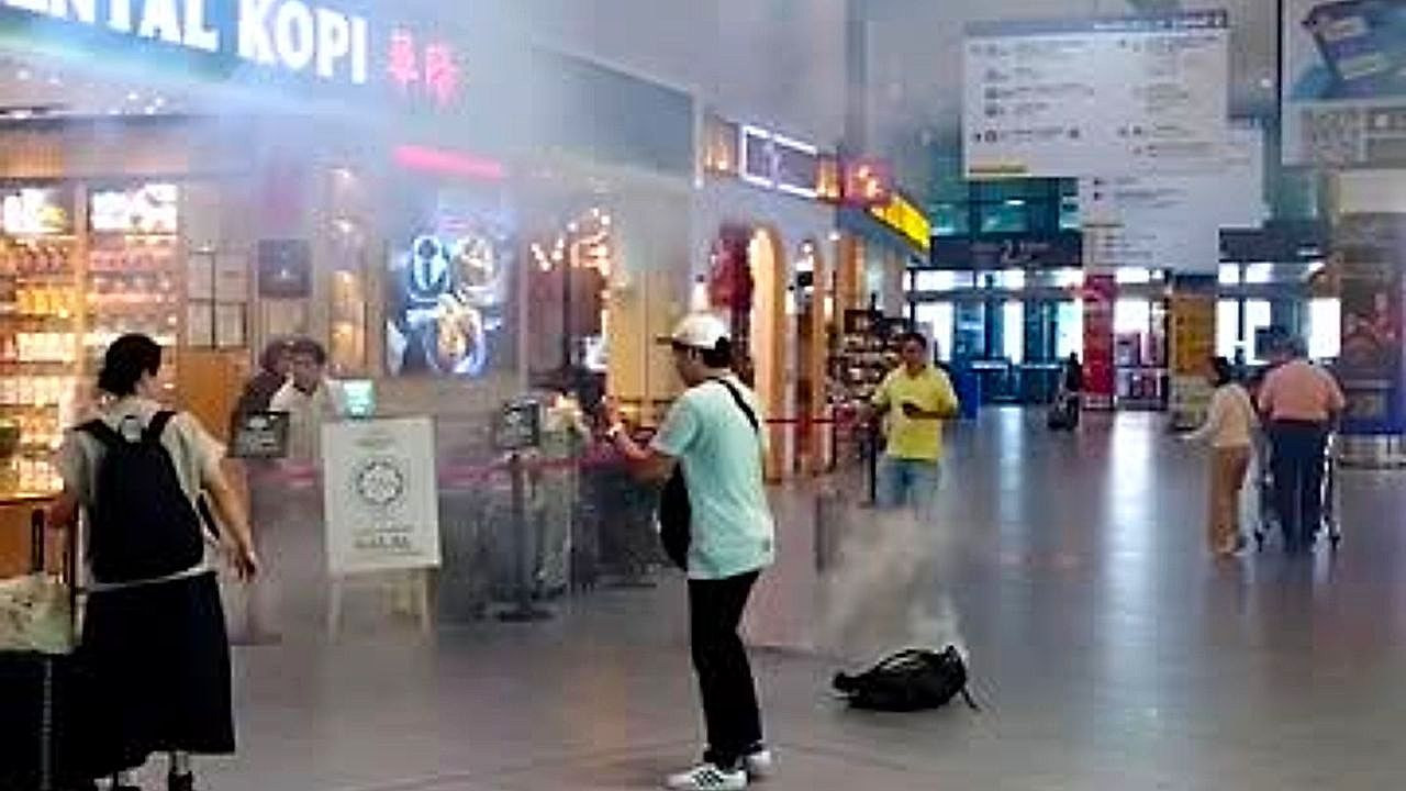 Video: Power bank explodes sending smoke and sparking panic in Malaysia airport