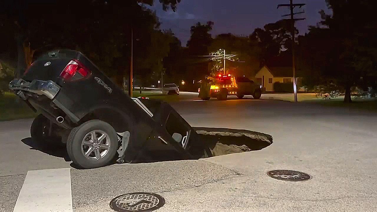 Video: Giant sinkhole swallows pickup truck in Texas