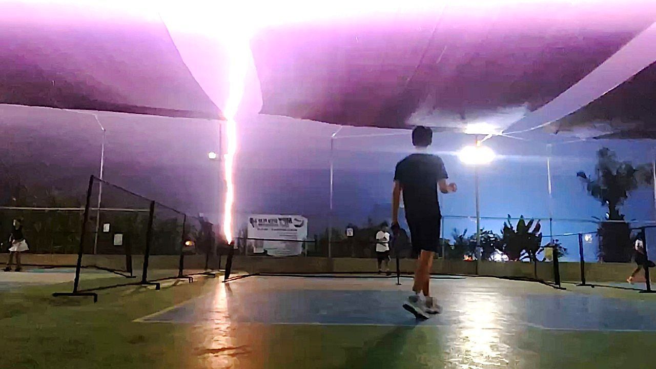 Video: Lightning strikes ground behind pickleball court and knocks out power mid-match