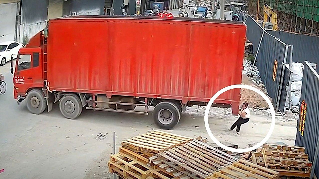 Video: Woman clings to runaway 20-tonne lorry mid-chase — and somehow stops it