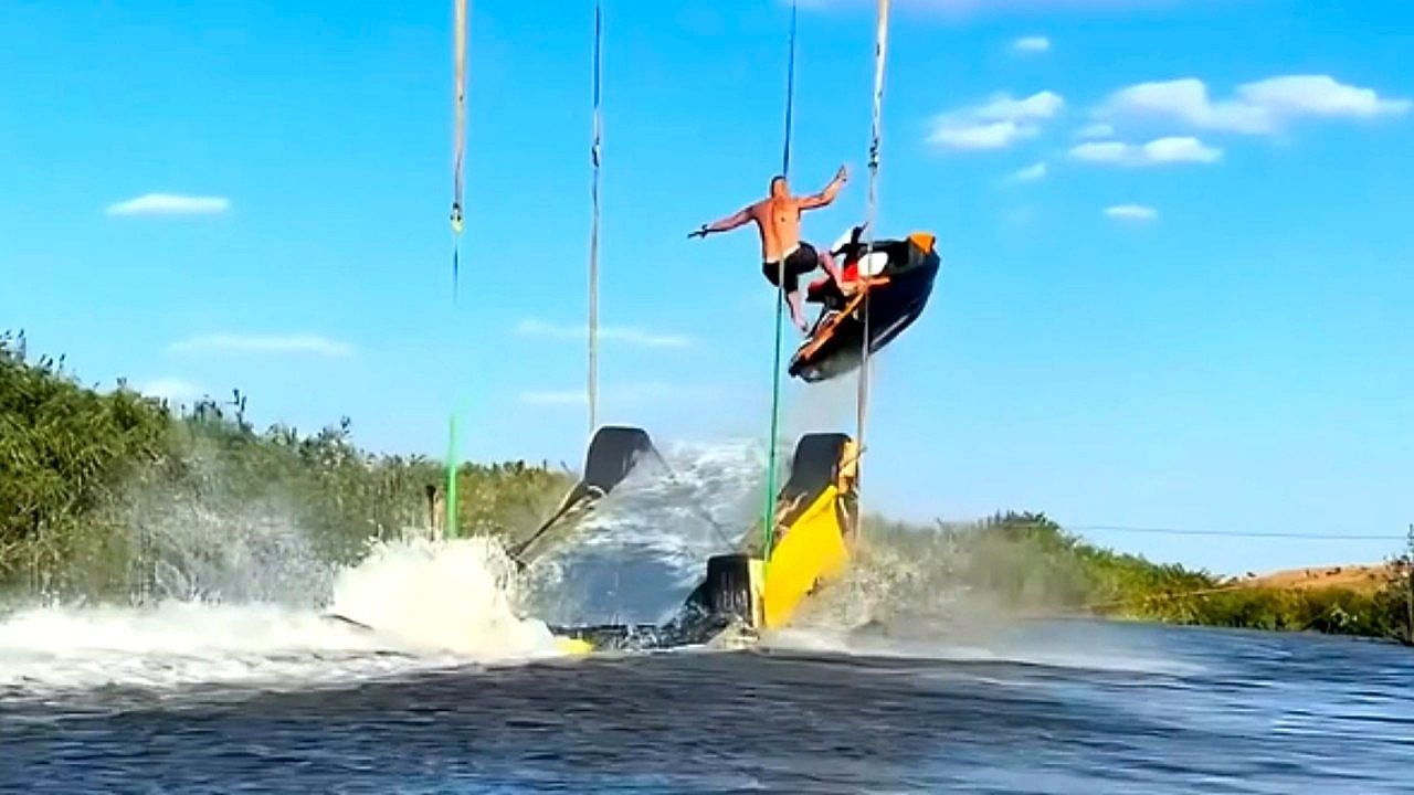 Video: Daredevil jet ski rider launches off suspended Ferrari in Russia
